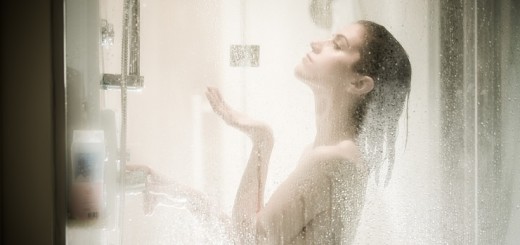 Beautiful brunette woman taking shower after long stressful day.Woman showering and enjoying bath.Using douche shower gel,body lotion,shower relaxing muscles.Depilation and anti cellulite treatment