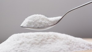 Put natural sweetener stevia from a pile into a spoon